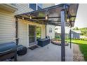 Cozy backyard patio with string lights, perfect for outdoor dining and entertaining by a sliding door entrance at 418 Eastway Sw Ln, Conover, NC 28613