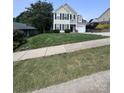 Beautiful two-story home with dark shutters, a lush lawn, and a basketball hoop at 418 Eastway Sw Ln, Conover, NC 28613
