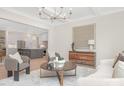 Open-concept living room with view into kitchen, modern furnishings, and stylish decor at 514 W Cama St, Charlotte, NC 28217