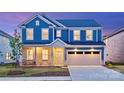 Charming two-story home with a blue exterior and stone accents at 5948 Chumbley Point Rd # 79, Charlotte, NC 28215