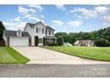 Two-story home featuring a spacious lawn and two-car garage at 600 Capella Ct, Gastonia, NC 28056