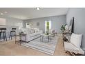 Bright living room with modern furnishings, neutral color scheme, and ample natural light at 7209 Cuddington Dr, Charlotte, NC 28215