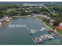 Breathtaking aerial view showcasing the home's waterfront location and private boat slip at 7600 Dunsmuir Ct, Cornelius, NC 28031