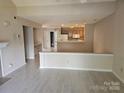 Bright and airy living room with views into kitchen area at 854 Southwest Dr, Davidson, NC 28036