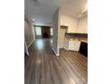 Open concept living space features wood floors, fireplace, and kitchen with modern appliances at 921 Nottingham Dr # 6, Gastonia, NC 28054