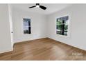 Well-lit bedroom features laminate flooring and ample natural light from the windows at 940 N New Hope Rd, Gastonia, NC 28054