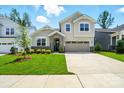 Charming two-story home with a well-manicured lawn and a two-car garage at 9842 Quercus Ln, Huntersville, NC 28078