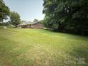 Sprawling green yard surrounds the property, offering space for outdoor activities and relaxation at 117 Lincoln Village Dr, Statesville, NC 28677