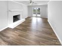 A spacious living room features hard surface floors and a large fireplace at 124 Creek Hollow Trl, Belmont, NC 28012