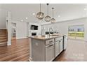 Open concept kitchen with stainless steel appliances and a center island at 12536 Stoneybrook Pkwy, Huntersville, NC 28078