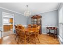 Elegant dining room featuring hardwood floors and chandelier lighting fixture at 126 Rocky Trail Ct, Fort Mill, SC 29715