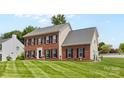 Charming brick home boasts manicured lawn and traditional black window shutters at 126 Rocky Trail Ct, Fort Mill, SC 29715