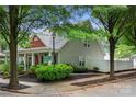 Attractive home exterior showcasing well-maintained landscaping and a delightful front porch at 12663 Windyedge Rd, Huntersville, NC 28078