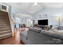 Inviting living room featuring an open floor plan, high ceilings, and hardwood floors at 12663 Windyedge Rd, Huntersville, NC 28078