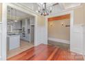 View of the dining room that leads to the kitchen and mudroom with convenient coat hooks at 135 Waycross Dr, Rockwell, NC 28110