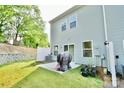 Private backyard featuring a patio area ideal for outdoor dining and relaxation in a serene setting at 1365 Eagle Claw Dr, Kannapolis, NC 28083