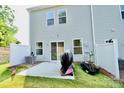 Charming backyard showcasing a patio and grassy area, perfect for entertaining and enjoying outdoor activities at 1365 Eagle Claw Dr, Kannapolis, NC 28083