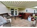 Covered back patio with hot tub, workout station and seating at 1545 Lewis Farm Rd, Kings Mountain, NC 28086