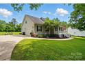 This home boasts an attached two-car garage, well-kept lawn, and inviting curb appeal at 1621 California Rd, York, SC 29745