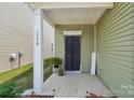 Charming home entrance with decorative door and porch, adding a touch of personality to the home's curb appeal at 1770 Troon Dr, Salisbury, NC 28144