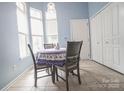 Bright breakfast nook with tile flooring and a charming table setting near large windows at 19182 Mallard Dr, Fort Mill, SC 29707