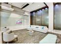 A modern lobby space with stylish seating, a sleek waterfall feature, and contemporary design elements at 210 N Church St # 2807, Charlotte, NC 28202