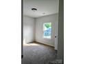Cozy bedroom with neutral carpet, large window offering natural light, and ample closet space at 2199 Catawba Trace Dr, Catawba, NC 28609