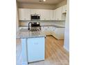 Modern kitchen featuring granite countertops, stainless steel appliances, and ample cabinet space at 2199 Catawba Trace Dr, Catawba, NC 28609
