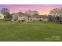 Expansive backyard with lush green lawn, perfect for outdoor activities and entertaining at 2316 Woodfield Cir, Gastonia, NC 28056