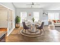 Bright dining area features a round table, modern chairs, and a stylish rug, perfect for Gathering meals at 2316 Woodfield Cir, Gastonia, NC 28056