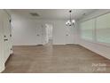 Spacious living room featuring wood flooring and natural light at 2620 Poplar Cove Nw Dr, Concord, NC 28027