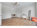 Spacious room with hardwood floors, natural light, ceiling fan, and neutral walls at 3725 Leela Palace Way, Fort Mill, SC 29708