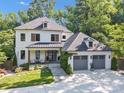 Inviting two-story home with modern farmhouse design and a well-maintained lawn at 4211 Tangle Dr, Charlotte, NC 28211