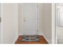 Welcoming entryway with hardwood floors and a stylish rug at 4714 Adamshire Ave, Concord, NC 28025