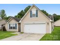 Inviting single-Gathering home showcasing a two-car garage and a lush green lawn at 4714 Adamshire Ave, Concord, NC 28025