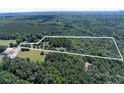 Expansive property with new construction, bordered by lush trees, and defined by surveyor's lines at 5410 A R Gordon Rd, Waxhaw, NC 28173