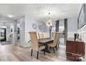Formal dining room features a modern chandelier and large windows that provide natural light at 7809 Creek Park Dr, Denver, NC 28037