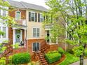 Charming townhome with brick facade, landscaped front yard, and inviting entryway at 815 Granby Dr, Fort Mill, SC 29708