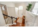 Bright foyer with hardwood floors, staircase, and a charming arched window above the door at 815 Granby Dr, Fort Mill, SC 29708