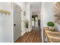 Bright hallway with wood floors, stylish decor, and a view into the open-concept living space at 915 Northeast Dr # 15, Davidson, NC 28036