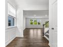 Bright living room boasts gleaming hardwood floors and plenty of natural light at 15208 Caspian Way, Charlotte, NC 28278