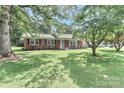 Beautiful brick home featuring a lush lawn and established trees at 158 Jane Sowers Rd, Statesville, NC 28625