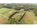 Panoramic aerial view of a sprawling property showcasing the home, outbuildings, and surrounding lush greenery and landscape at 1720 Lowe Dr, Catawba, NC 28609