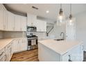 Well-appointed kitchen featuring a center island, stainless steel appliances, and modern pendant lighting at 173 Morgans Branch Rd, Belmont, NC 28012