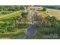 Scenic view of a tree-lined street in a new neighborhood, offering a serene and welcoming atmosphere at 21047 Running Creek Dr # 9, Locust, NC 28097