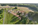 Aerial view of a planned community that features homes with large lots and many mature trees at 21071 Running Creek Dr # 12, Locust, NC 28097