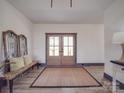 Charming entryway with a rustic bench, stylish rug, and elegant decor at 2410 Charlotte Hwy, York, SC 29745
