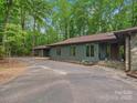 Charming single-story home with a stone facade, long driveway, and lush landscaping at 2730 Highway 557 Hwy, Clover, SC 29710