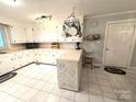 Bright kitchen with white cabinets, a stylish island, and modern appliances at 3158 Salisbury Hwy, Statesville, NC 28677