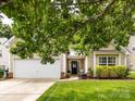 Inviting home with attached garage, black door and lush green lawn at 3347 Xandra Ct, Indian Land, SC 29707